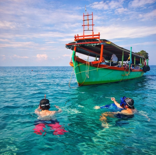 Split View Of Snorkeling In The Clear Waters Of Koh Rong Sanloem.